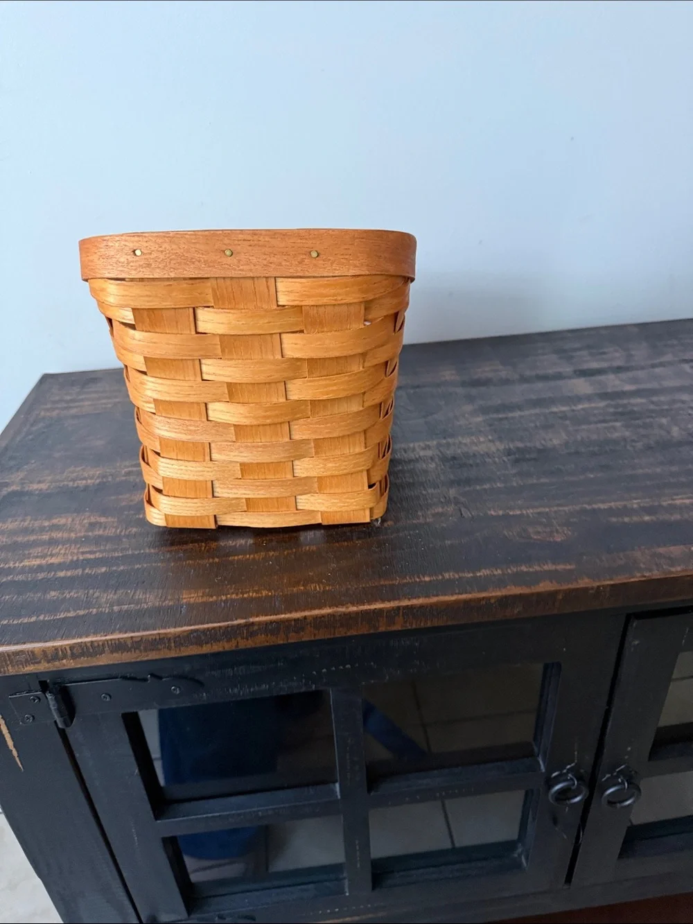 Handwoven Orange Storage Basket with Metal Badge
